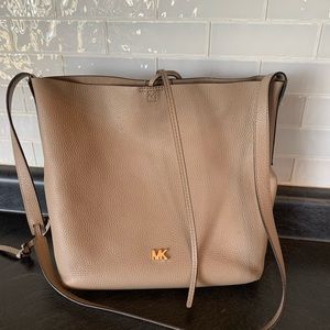 Tan Michael Kors tote/cross body.  In great condition. 11”wide by 11”tall.